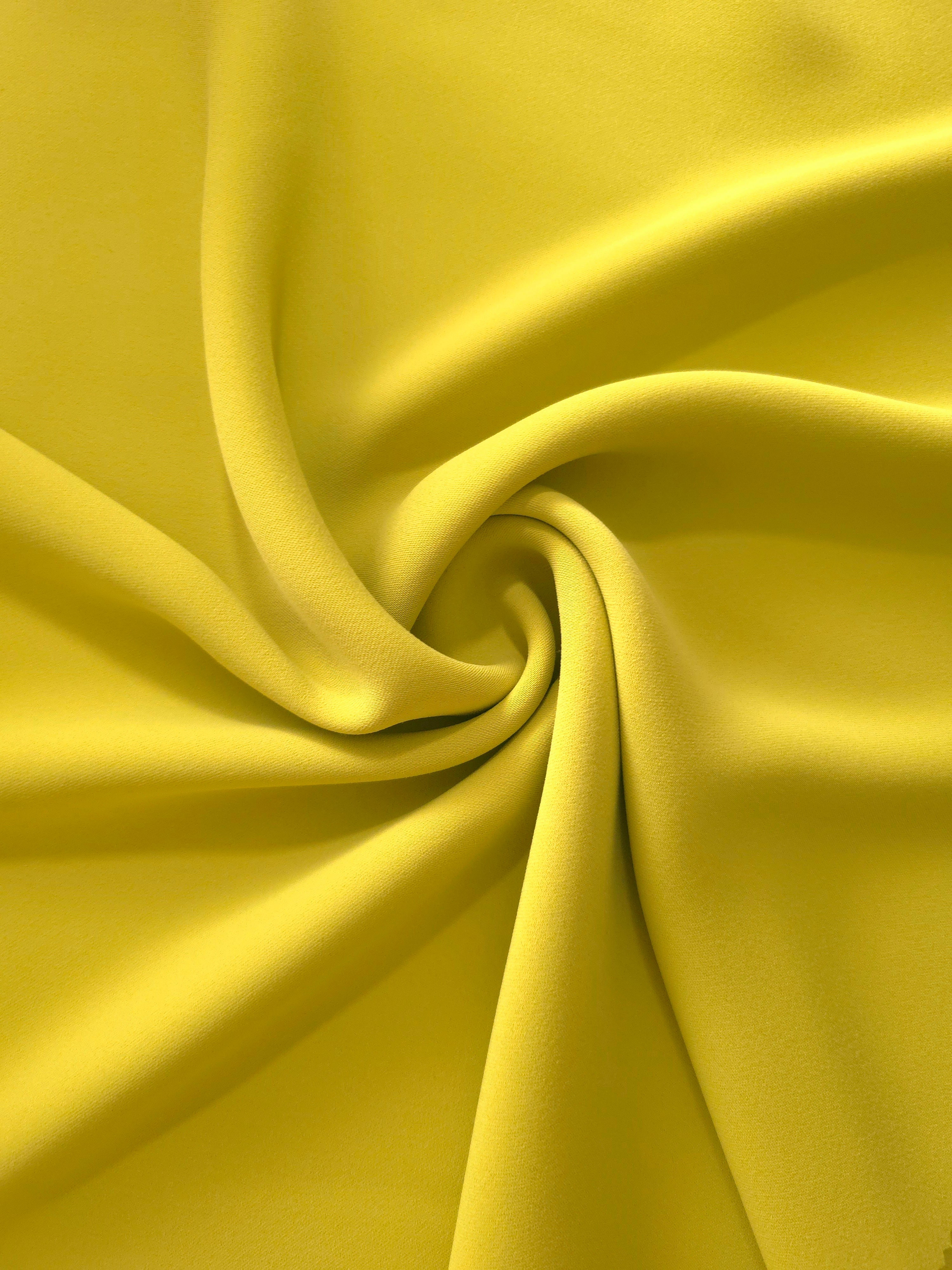 Olive Gold silky-feel polyester crepe in a flowing swirl, showing drape for abayas and modest fashion