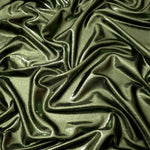Draped Olive Green shimmer spandex fabric with luminous foil reflection, suited to gowns, skirts and theatrical apparel