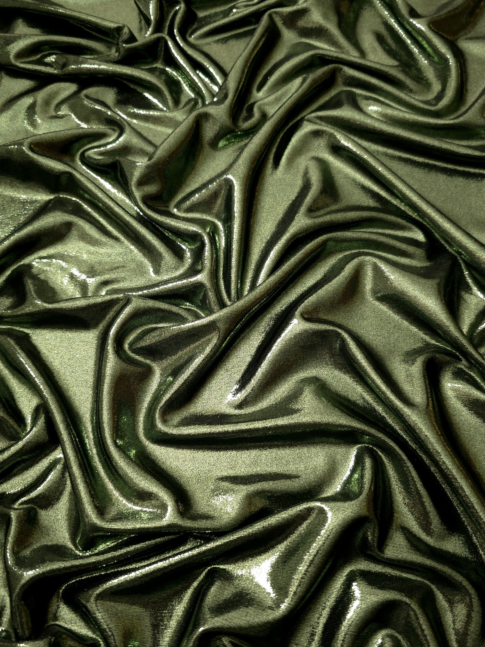 Draped Olive Green shimmer spandex fabric with luminous foil reflection, suited to gowns, skirts and theatrical apparel
