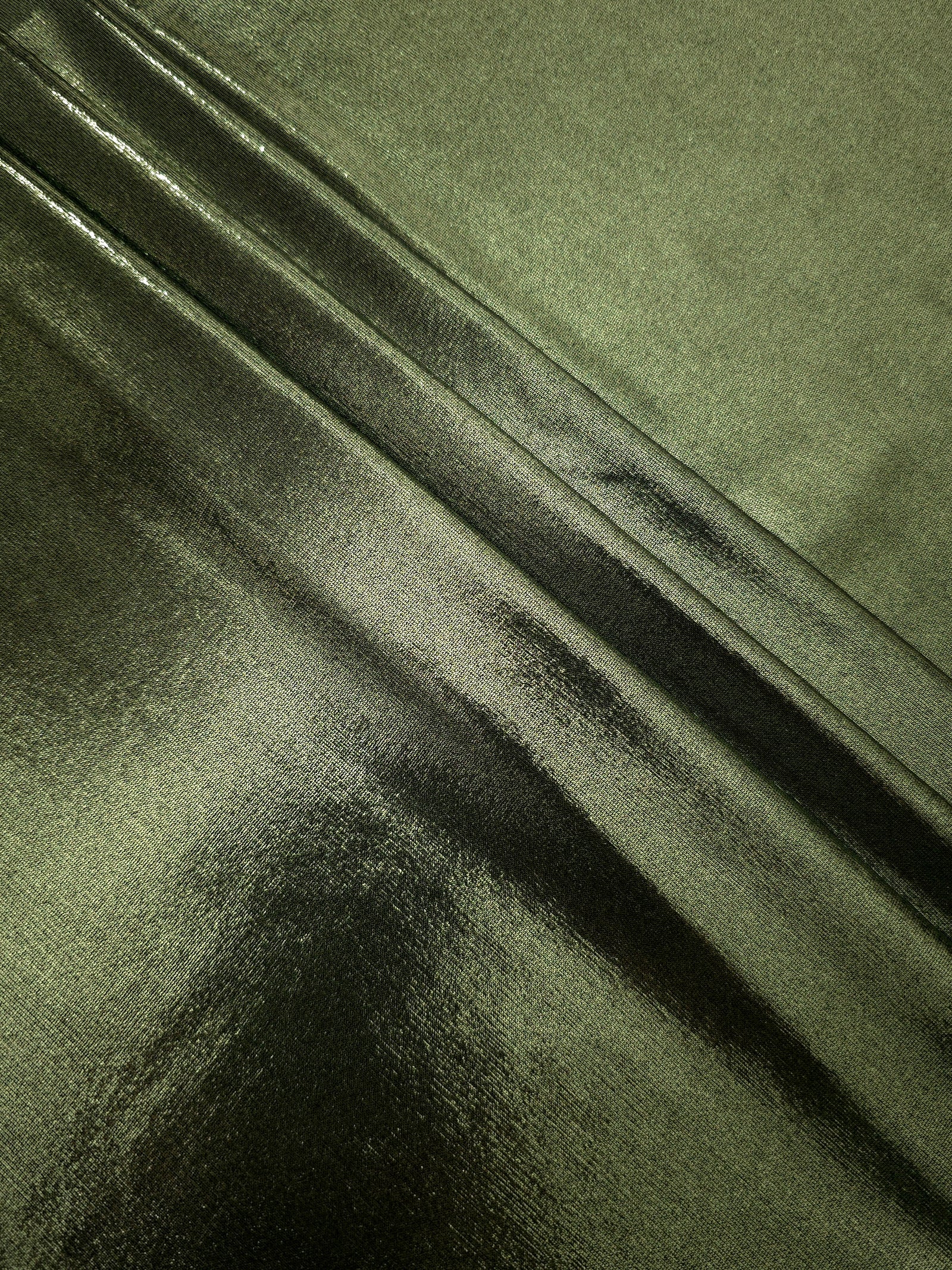 Olive Green shimmer spandex fabric stacked in soft layers, revealing metallic reflection for costumes, dresses and creative apparel
