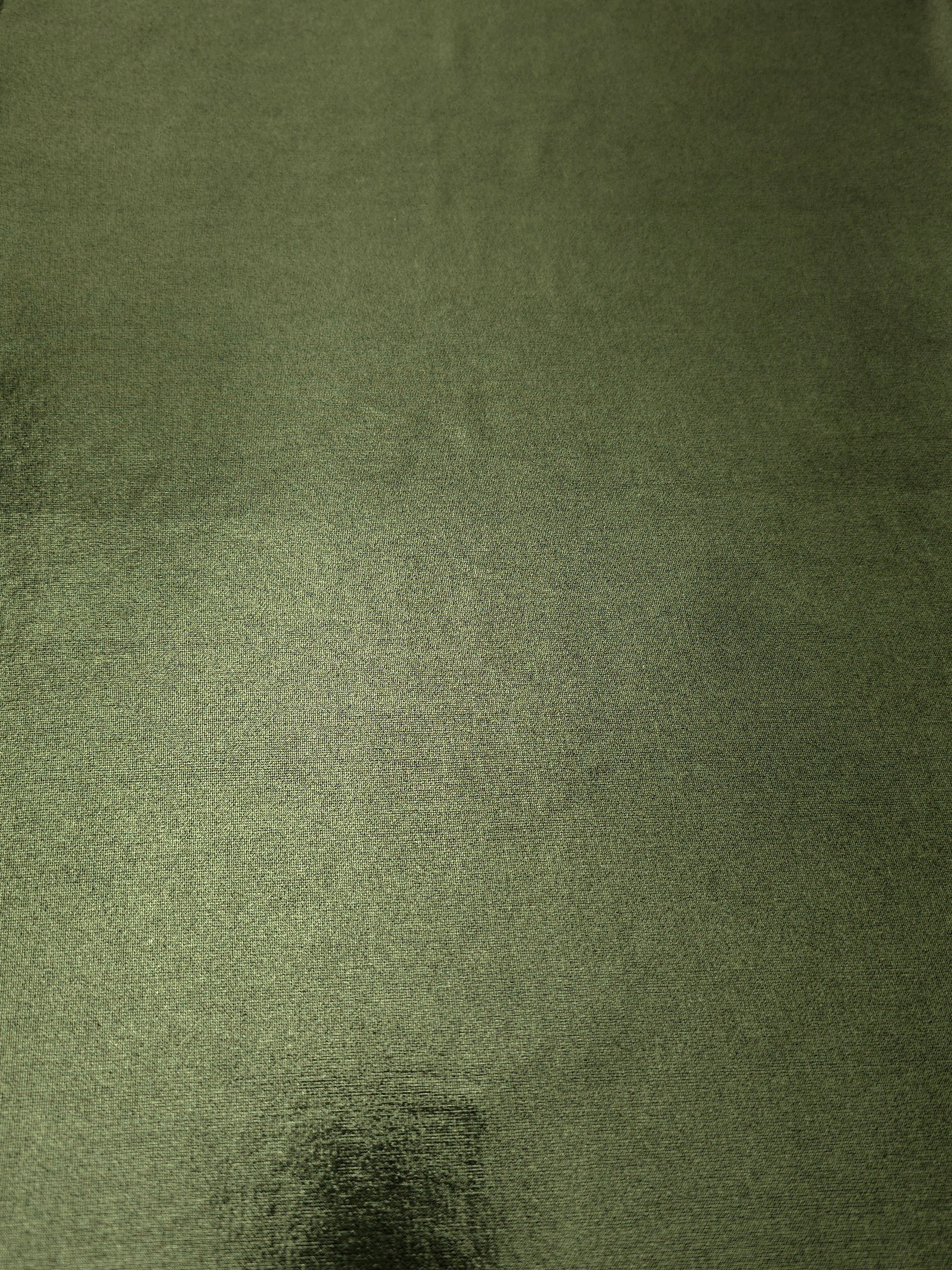Full surface of Olive Green metallic stretch fabric, highlighting luminous foil sheen for stage costumes, dresses and fashion design