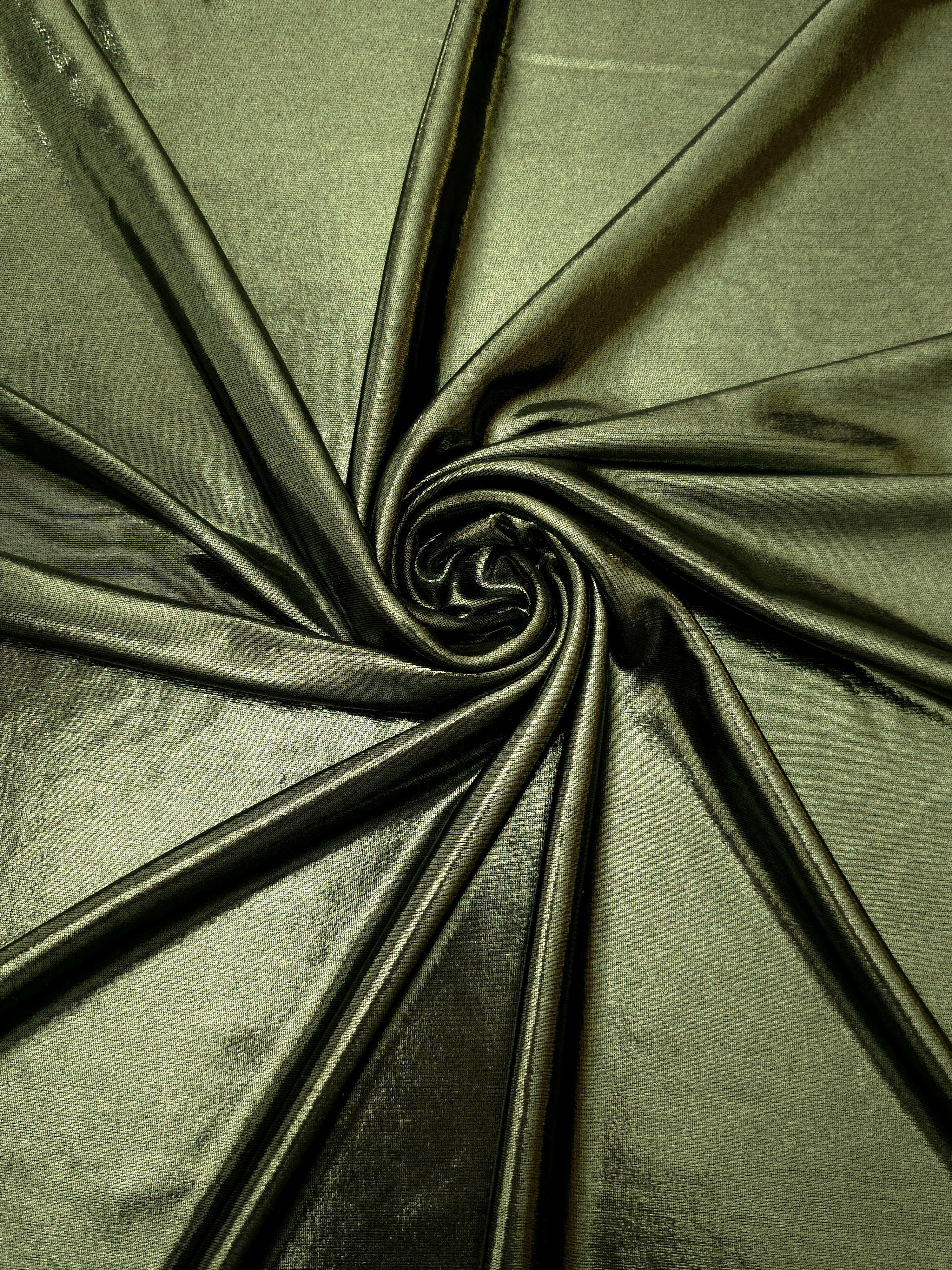 Spiraled Olive Green shimmer spandex fabric showing reflective movement for evening dresses, costumes and performance apparel