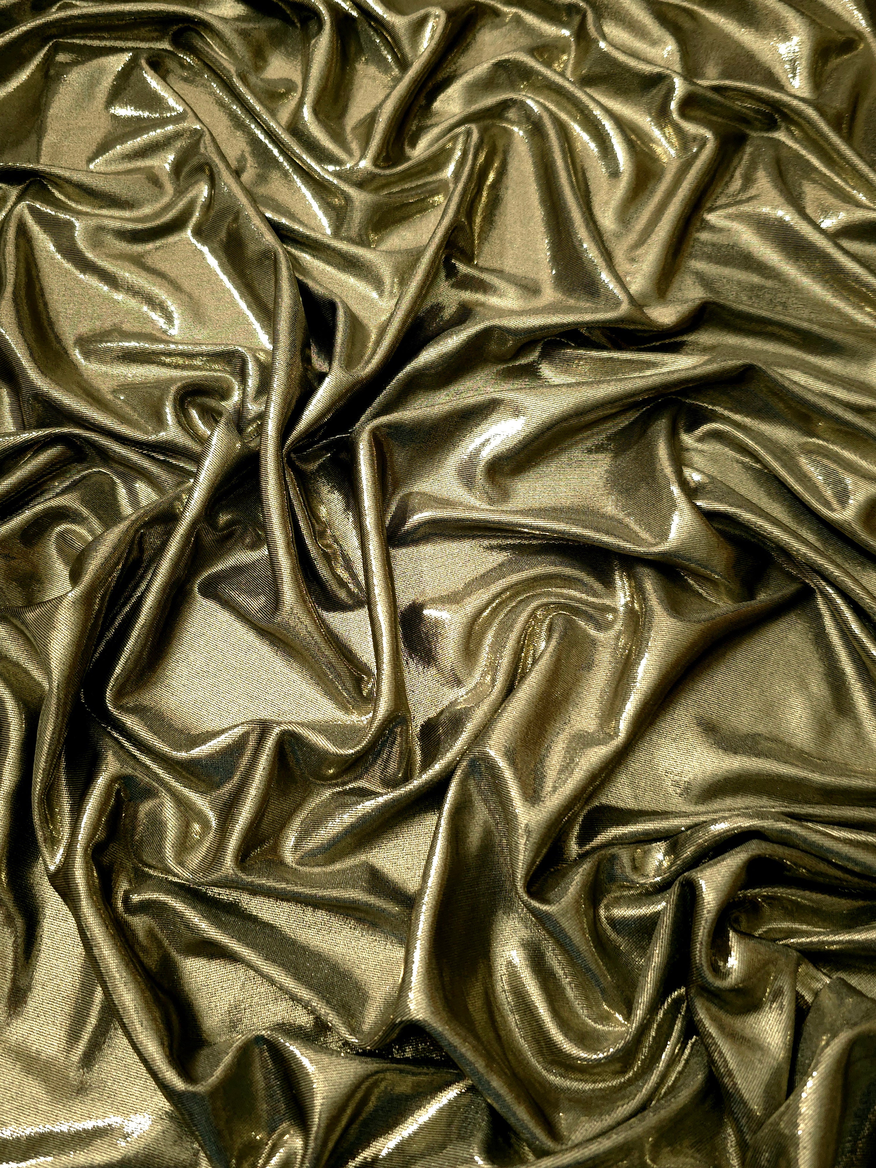 Draped Olive Khaki shimmer spandex fabric with luminous foil reflection, suited to gowns, skirts and theatrical apparel