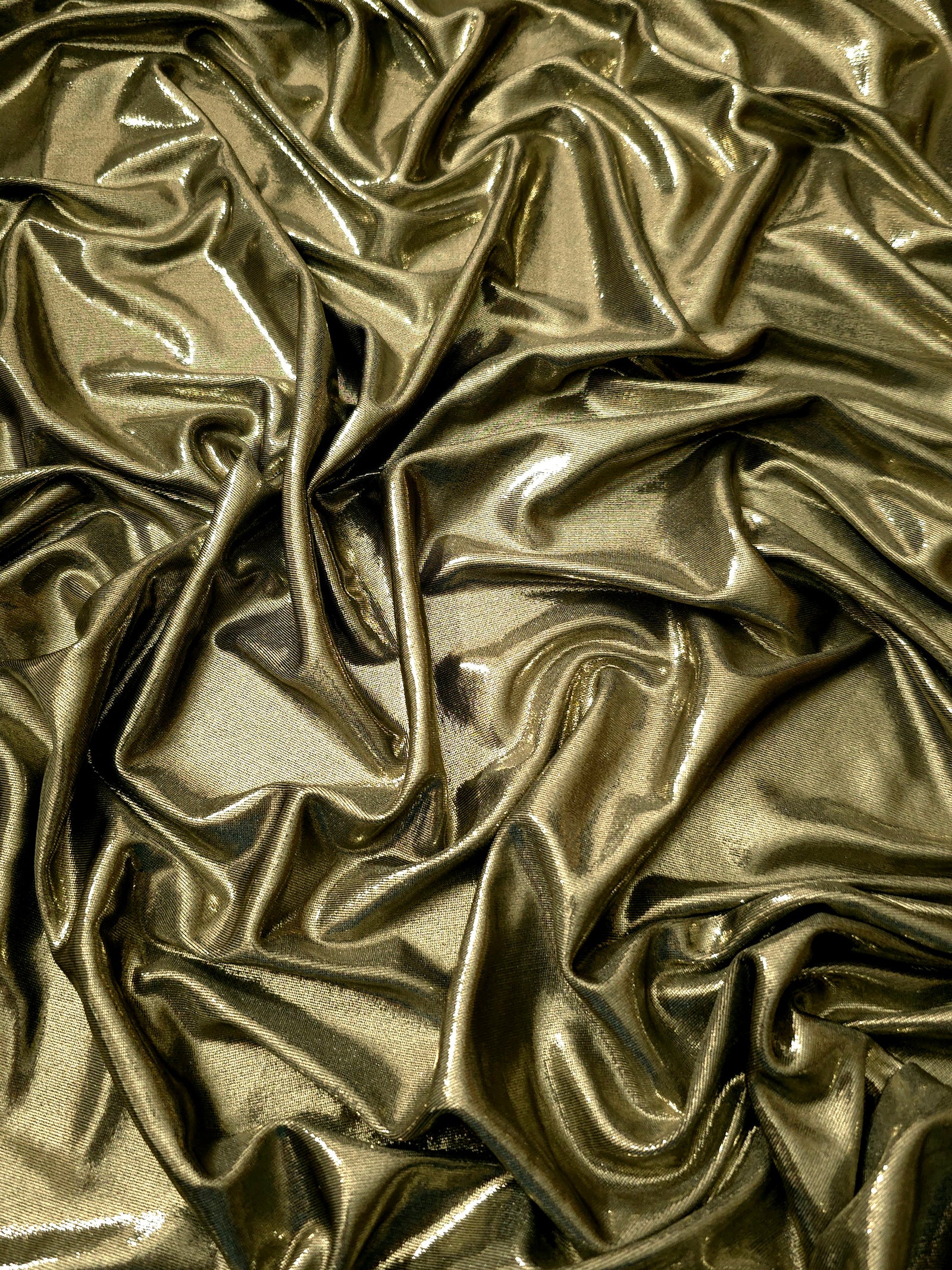 Draped Olive Khaki shimmer spandex fabric with luminous foil reflection, suited to gowns, skirts and theatrical apparel