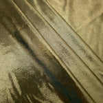Olive Khaki shimmer spandex fabric stacked in soft layers, revealing metallic reflection for costumes, dresses and creative apparel
