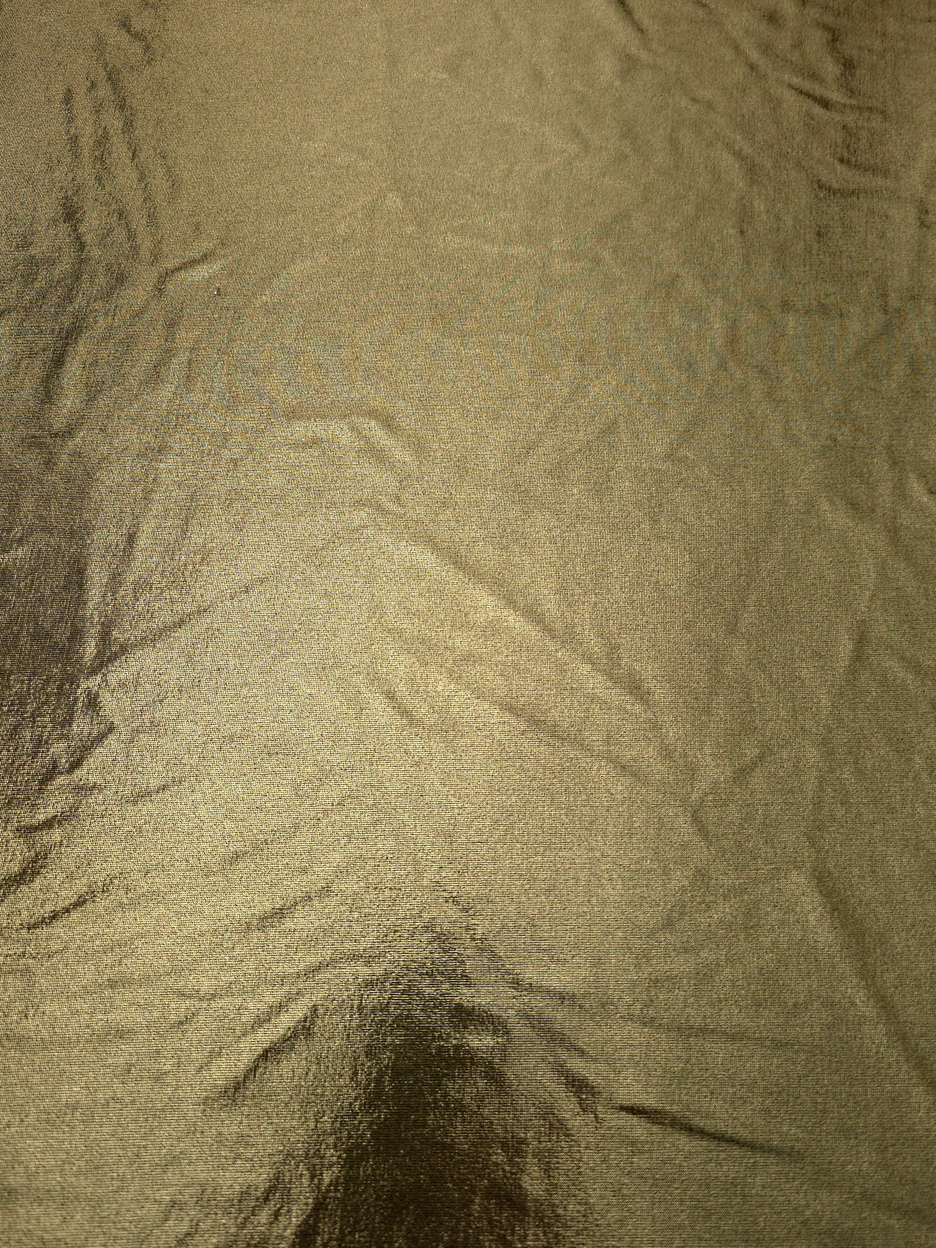 Full surface of Olive Khaki metallic stretch fabric, highlighting luminous foil sheen for stage costumes, dresses and fashion design