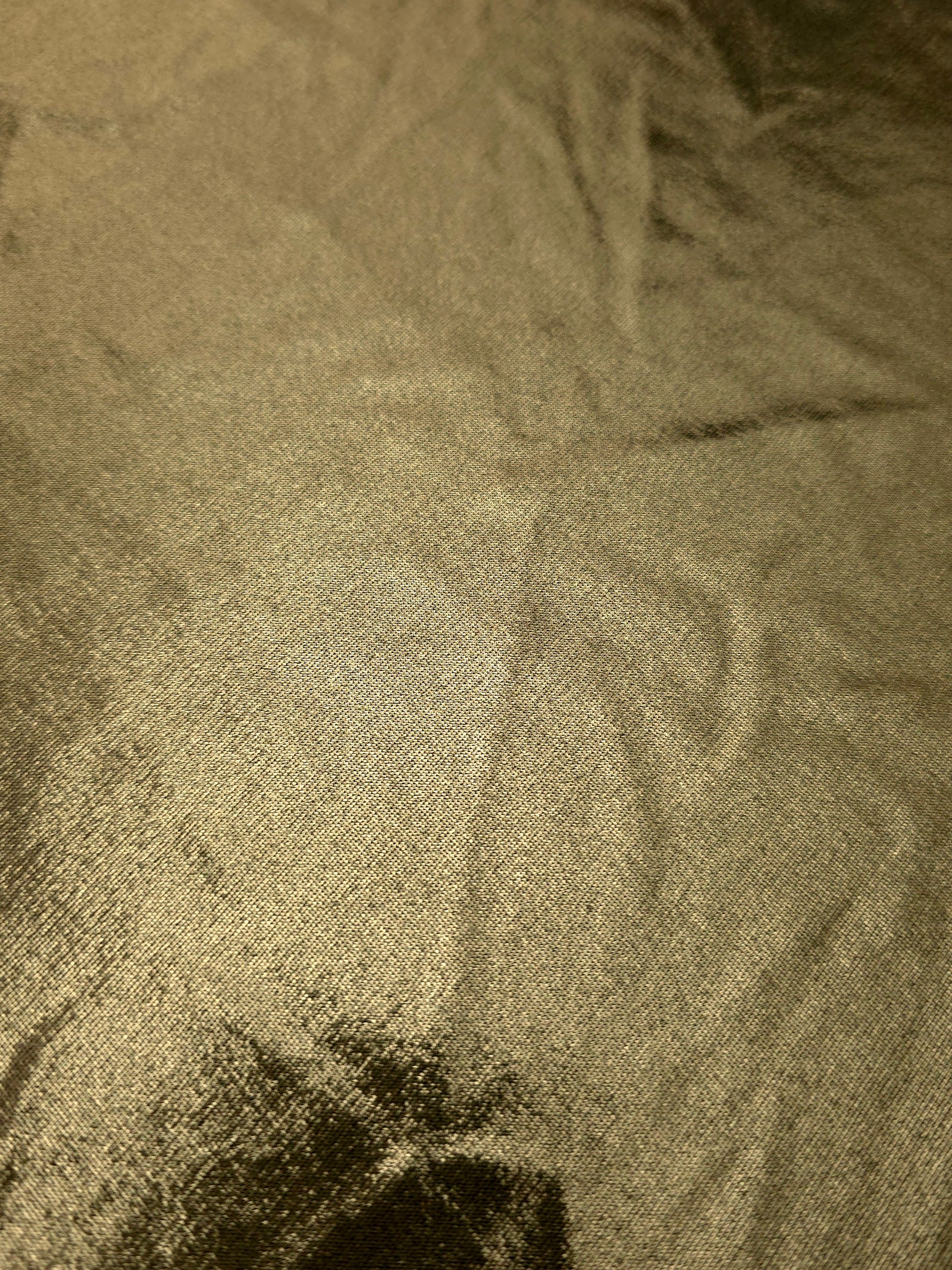 Texture view of Olive Khaki metallic stretch fabric, highlighting foil shimmer and surface detail for performance apparel