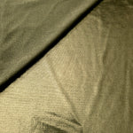 Gently folded Olive Khaki shimmer spandex fabric showing luminous foil finish for tops, skirts and occasion garments