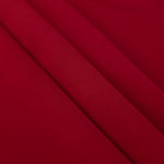 Oxblood Red Korean crepe in layered folds, showing soft structure and slight mechanical stretch for skirts