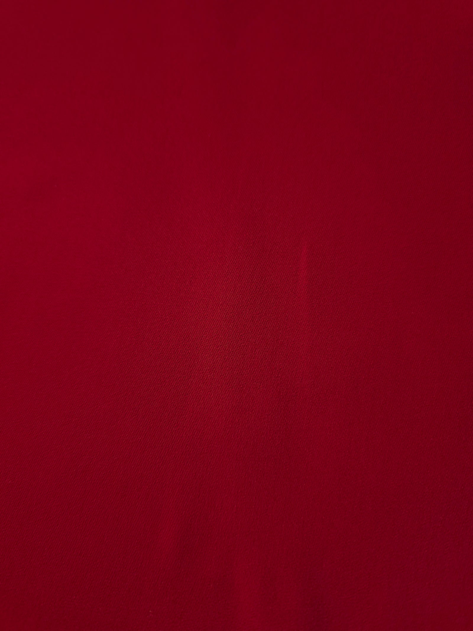 Oxblood Red Korean polyester crepe close-up showing the fine weave, smooth texture and silky-soft finish