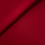 Soft fold of Oxblood Red opaque polyester crepe showing fluid dressmaking drape for dresses and skirts