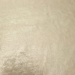 Detailed close-up of Pale Butter Cream foiled spandex fabric showing its luminous metallic surface and fine reflective texture