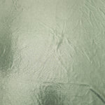 Pale Sage Green shimmer metallic foiled spandex shown flat, displaying reflective finish for dance costumes, skirts and event apparel