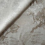 Brown palm vine jacquard fabric close-up detail with woven leaf motif and linen-look texture.