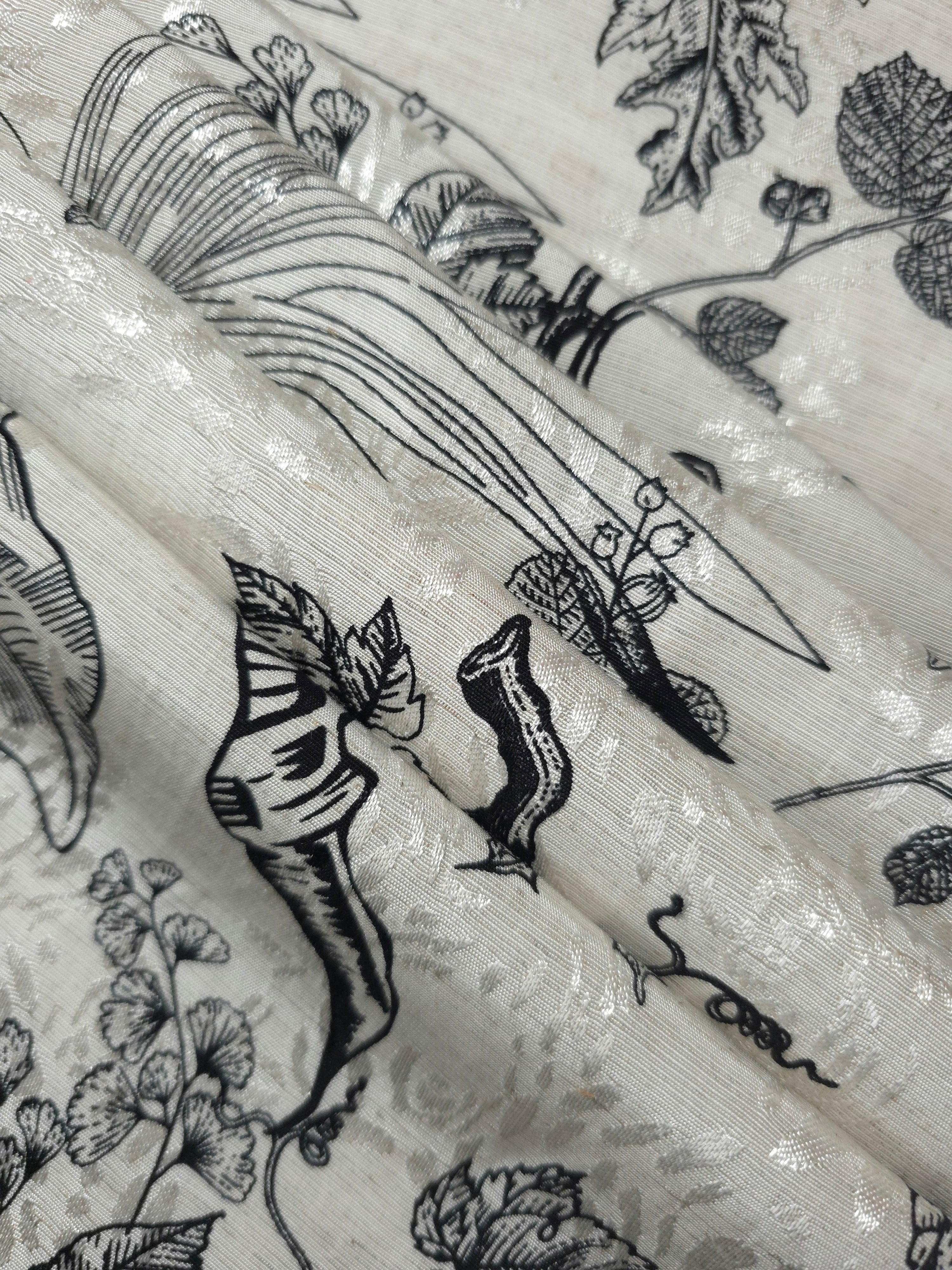 Reverse side of black palm vine jacquard fabric showing woven structure and linen-like surface.