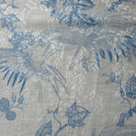 Blue palm vine linen-look jacquard fabric texture view with woven botanical pattern.