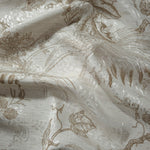 Brown palm vine linen-look jacquard fabric draped to show soft structure and tonal botanical pattern.