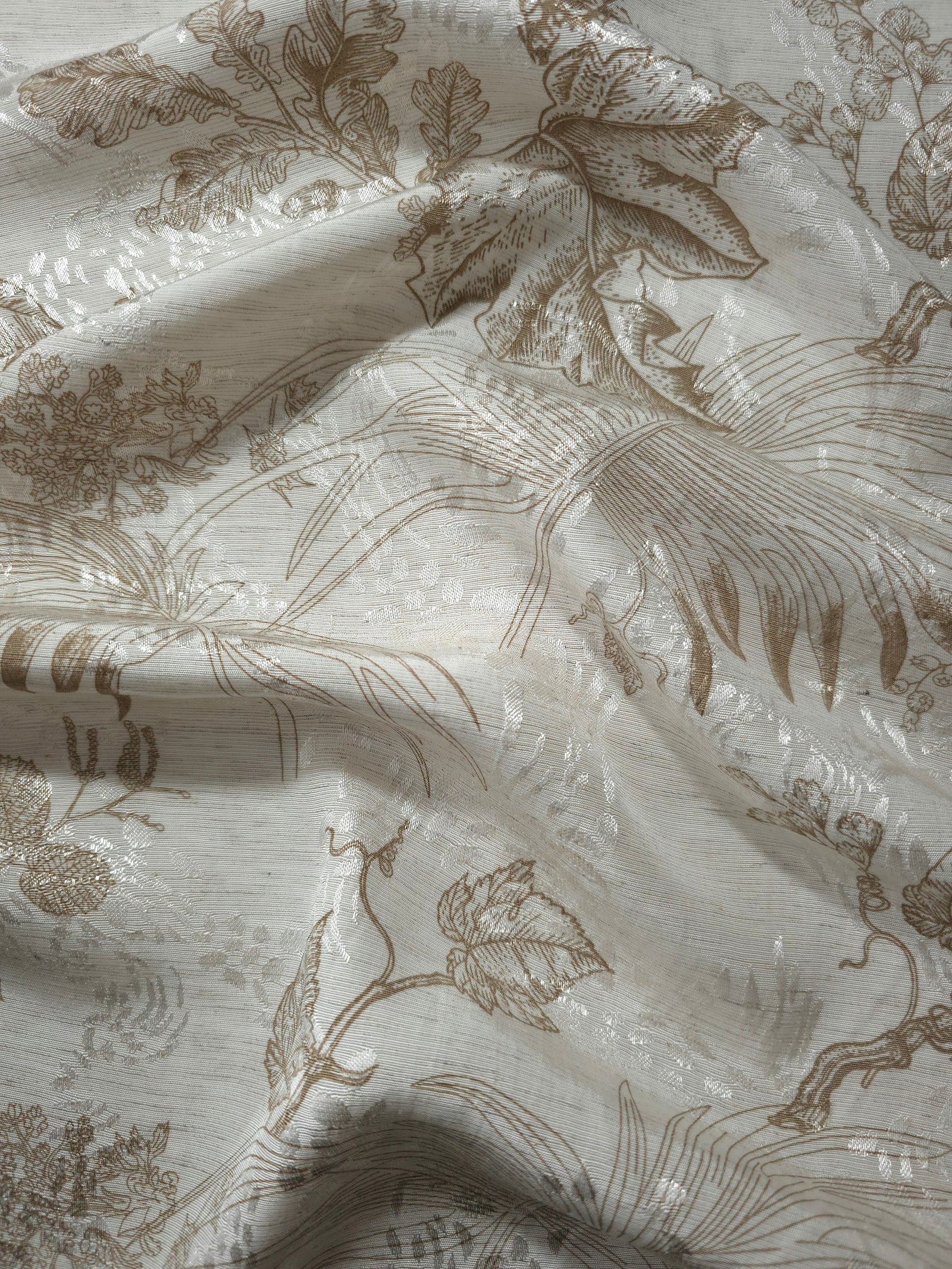Brown palm vine linen-look jacquard fabric draped to show soft structure and tonal botanical pattern.
