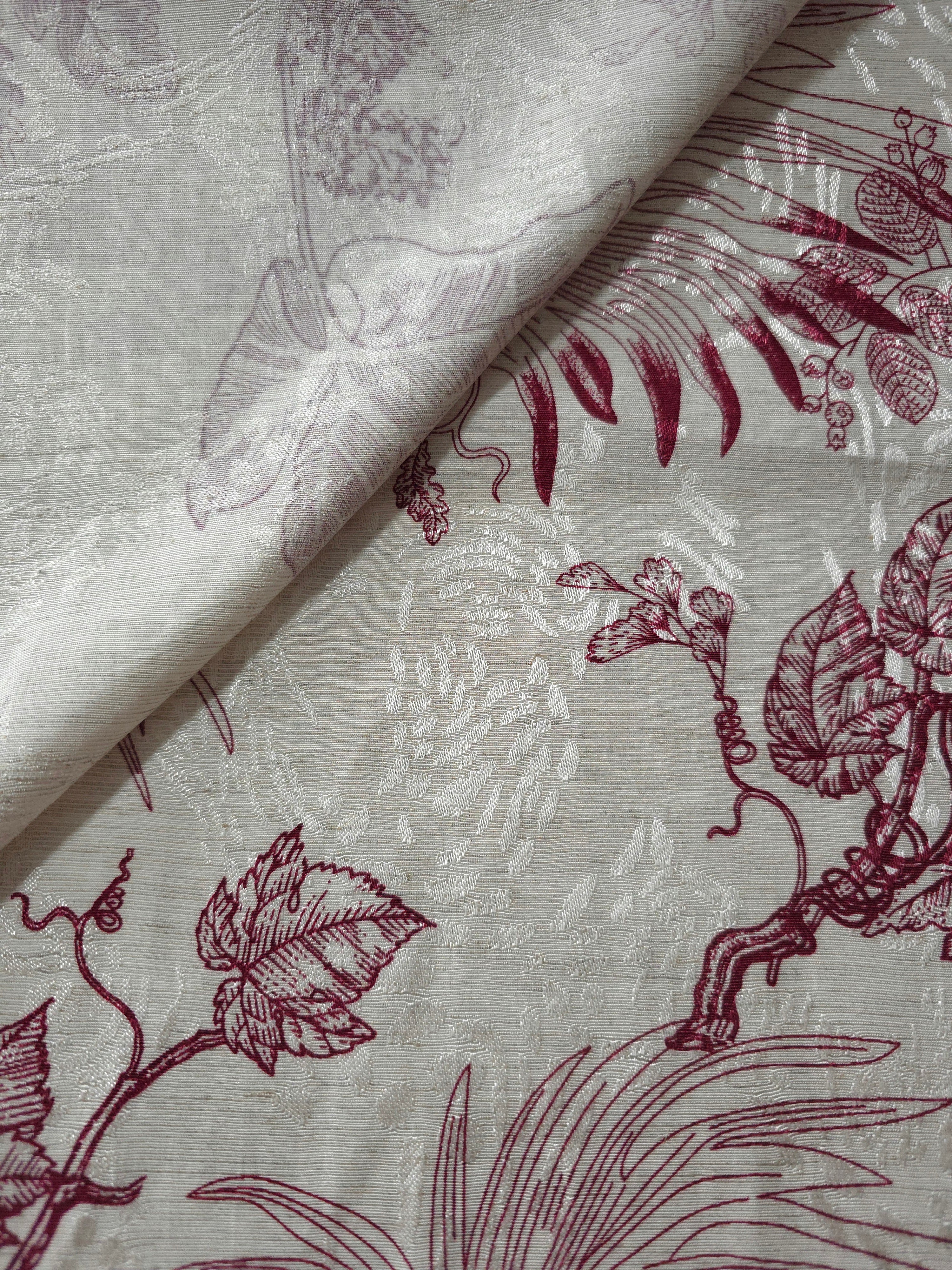 Deep red palm vine jacquard fabric close-up with woven leaf motif and linen-look texture.