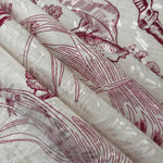Reverse side of deep red palm vine jacquard fabric showing woven structure and textured finish.