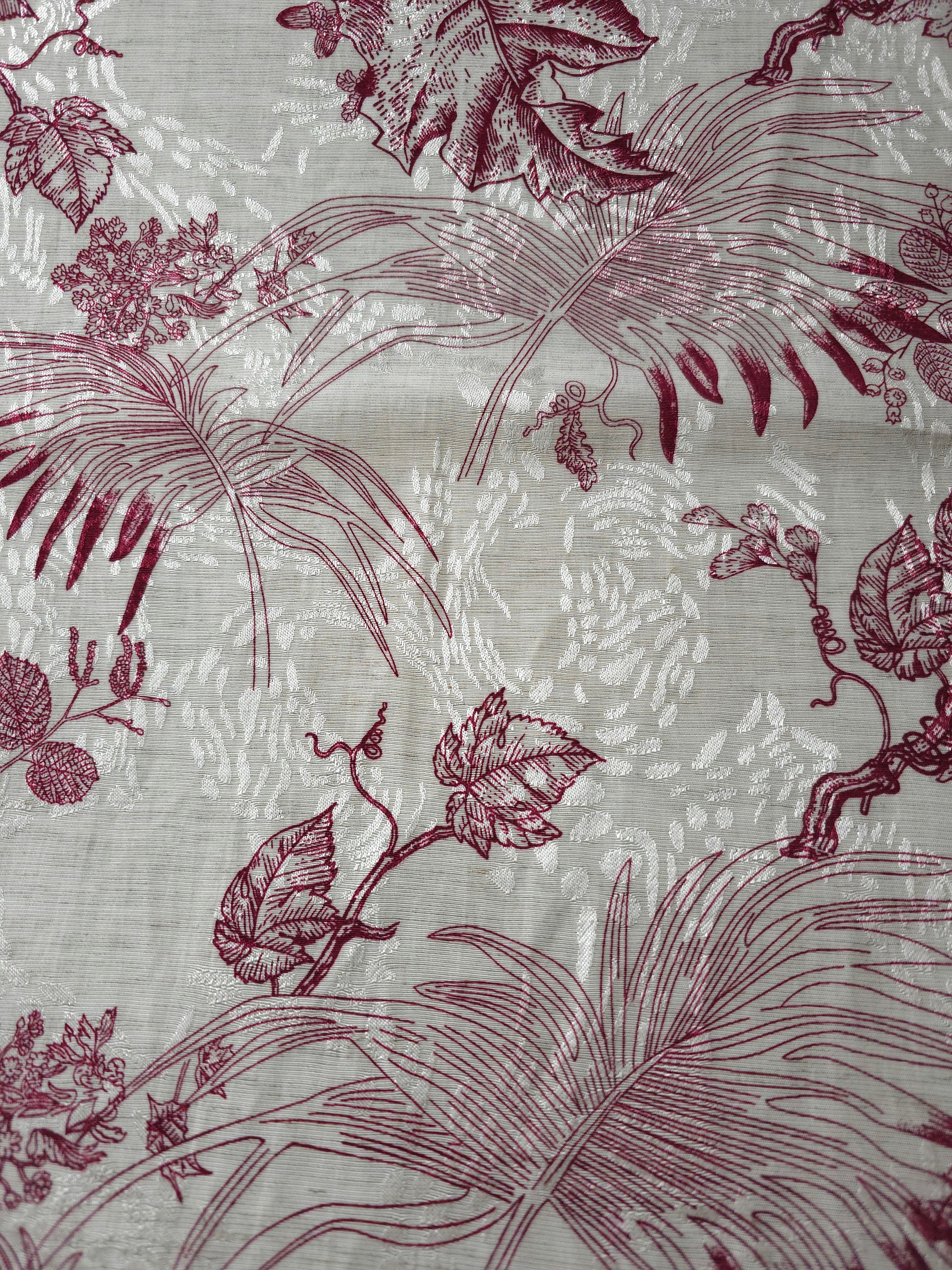 Texture view of deep red palm vine linen-look jacquard fabric with tonal leaf pattern.