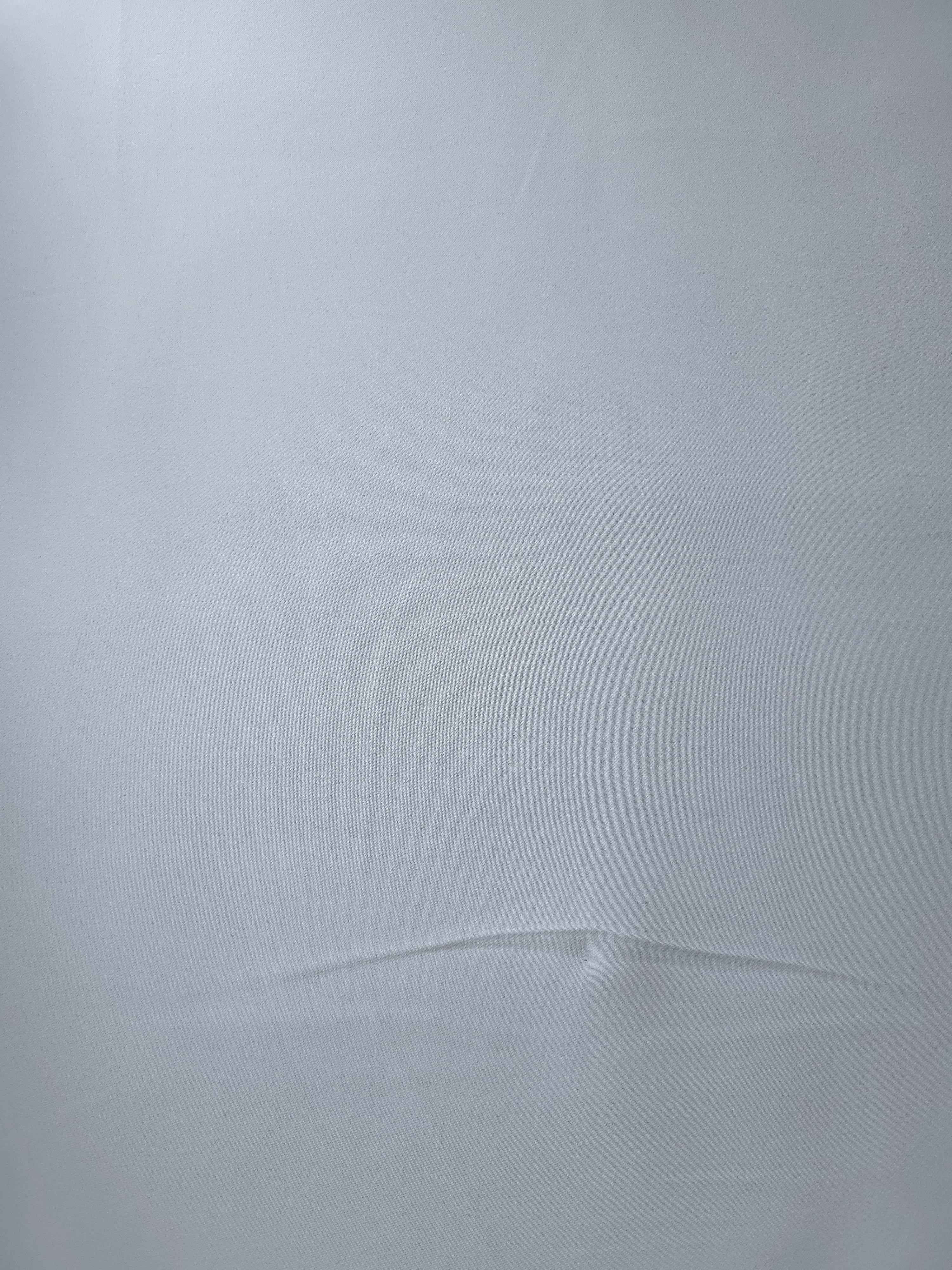 Pearl Blue Gray Italian polyester crepe shown flat, smooth apparel fabric for dresses and separates