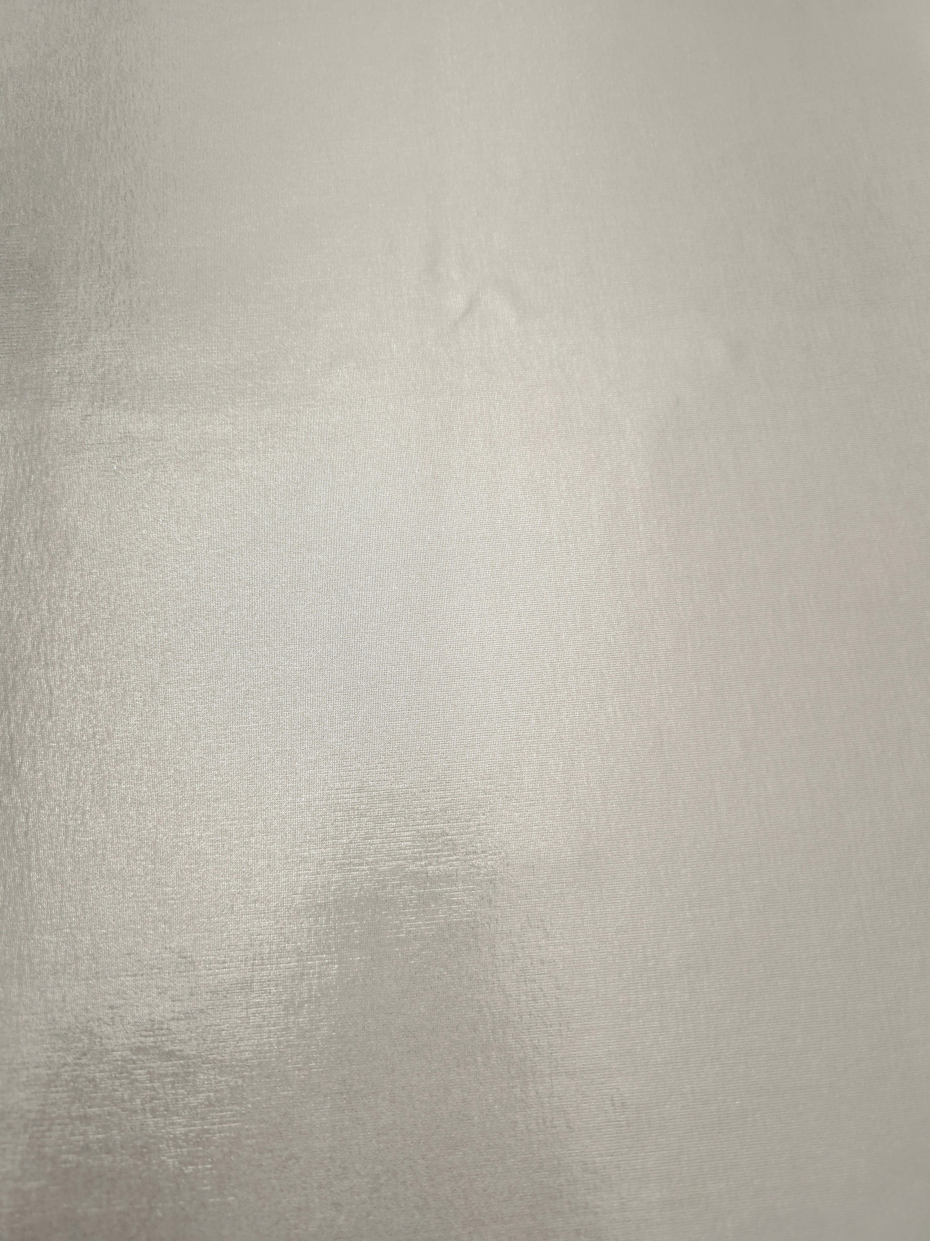 Pearl Ivory foiled spandex fabric surface showing even metallic shimmer and stretch-fabric finish for performance and occasionwear