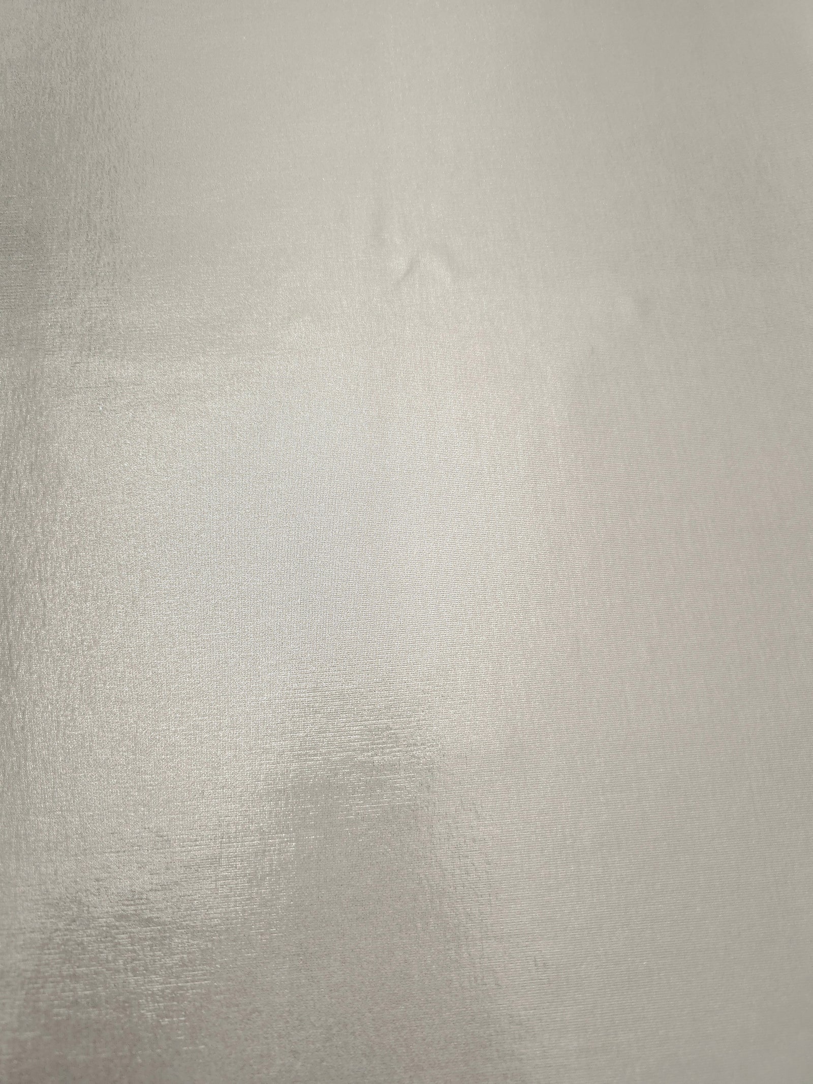 Pearl Ivory foiled spandex fabric surface showing even metallic shimmer and stretch-fabric finish for performance and occasionwear