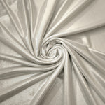 Pearl Ivory metallic stretch fabric in a flowing swirl, emphasizing foil shimmer and drape for partywear and statement fashion