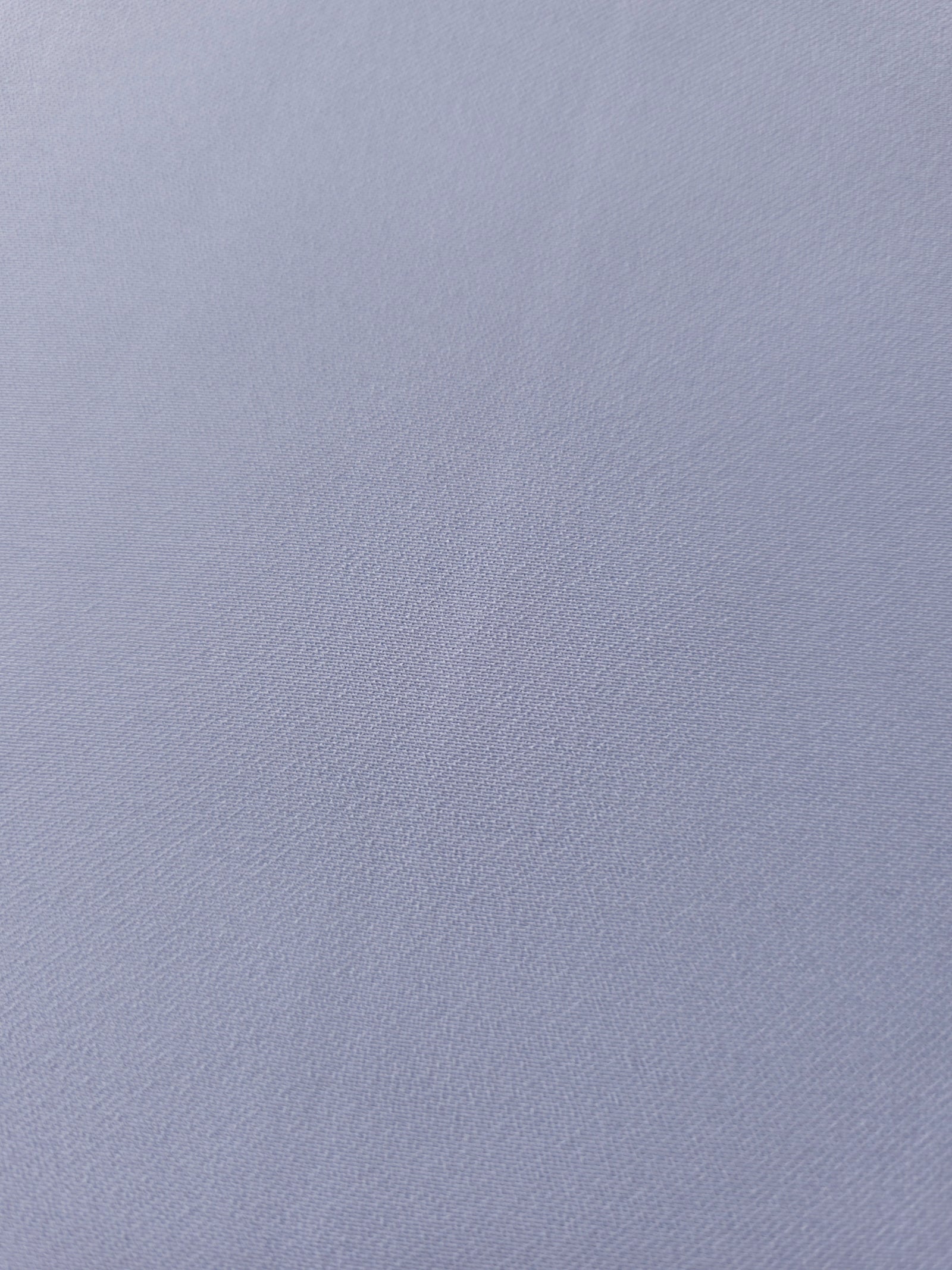 Periwinkle Blue mechanical polyester crepe in close-up, showing fine woven texture and a silky-soft surface