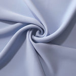 Periwinkle Blue silky-soft polyester crepe styled in a swirl to show fluid dressmaking drape and movement