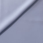 Periwinkle Blue opaque Korean polyester crepe in a soft fold, showing flowing drape for garment making