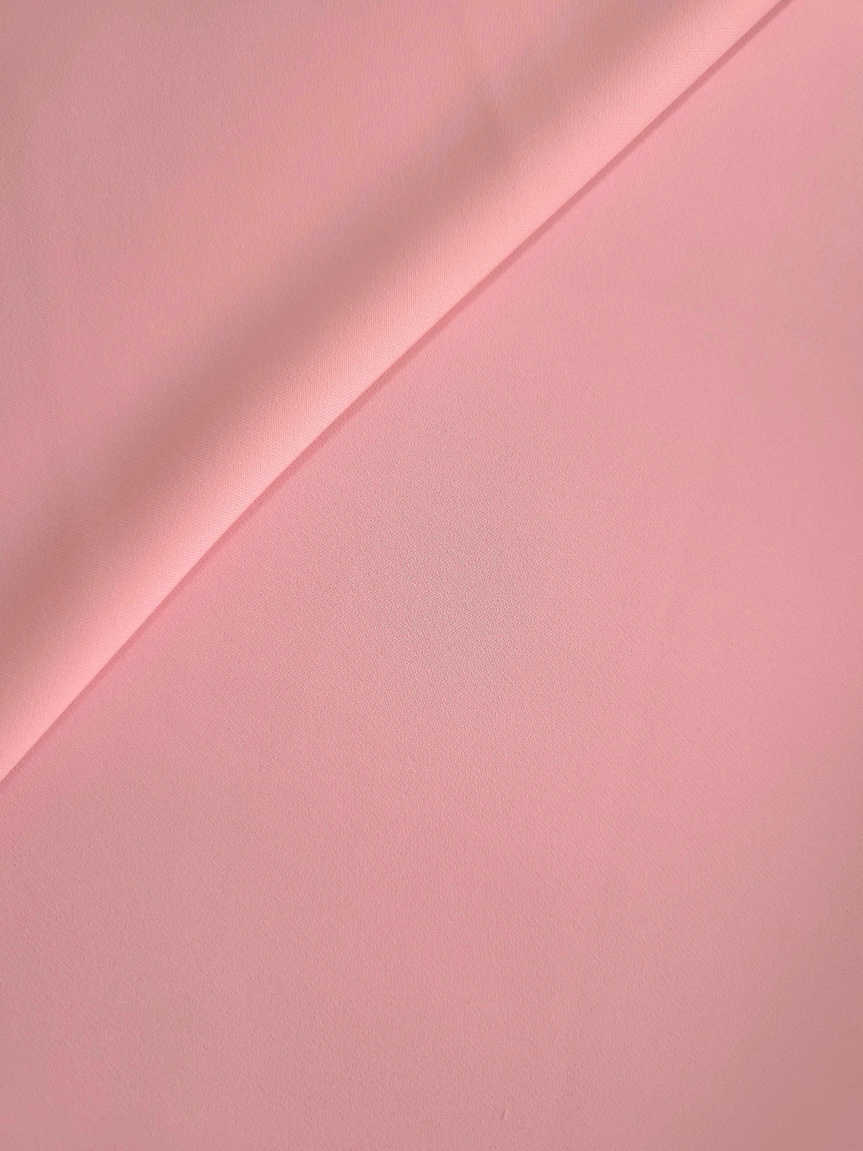 Soft-fold view of Powder Rose Pink Italian polyester crepe showing fluid drape for blouses, skirts and dresses