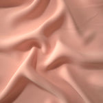 Rose Beige Korean crepe displayed in fluid draped folds for eveningwear, skirts and flowing garments