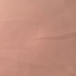 Woven close-up of Rose Beige mechanical polyester crepe showing smooth texture and a soft silky-feel finish
