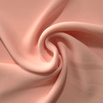 Spiral styling of Rose Beige Korean polyester crepe showing supple drape for abayas, dresses and occasionwear