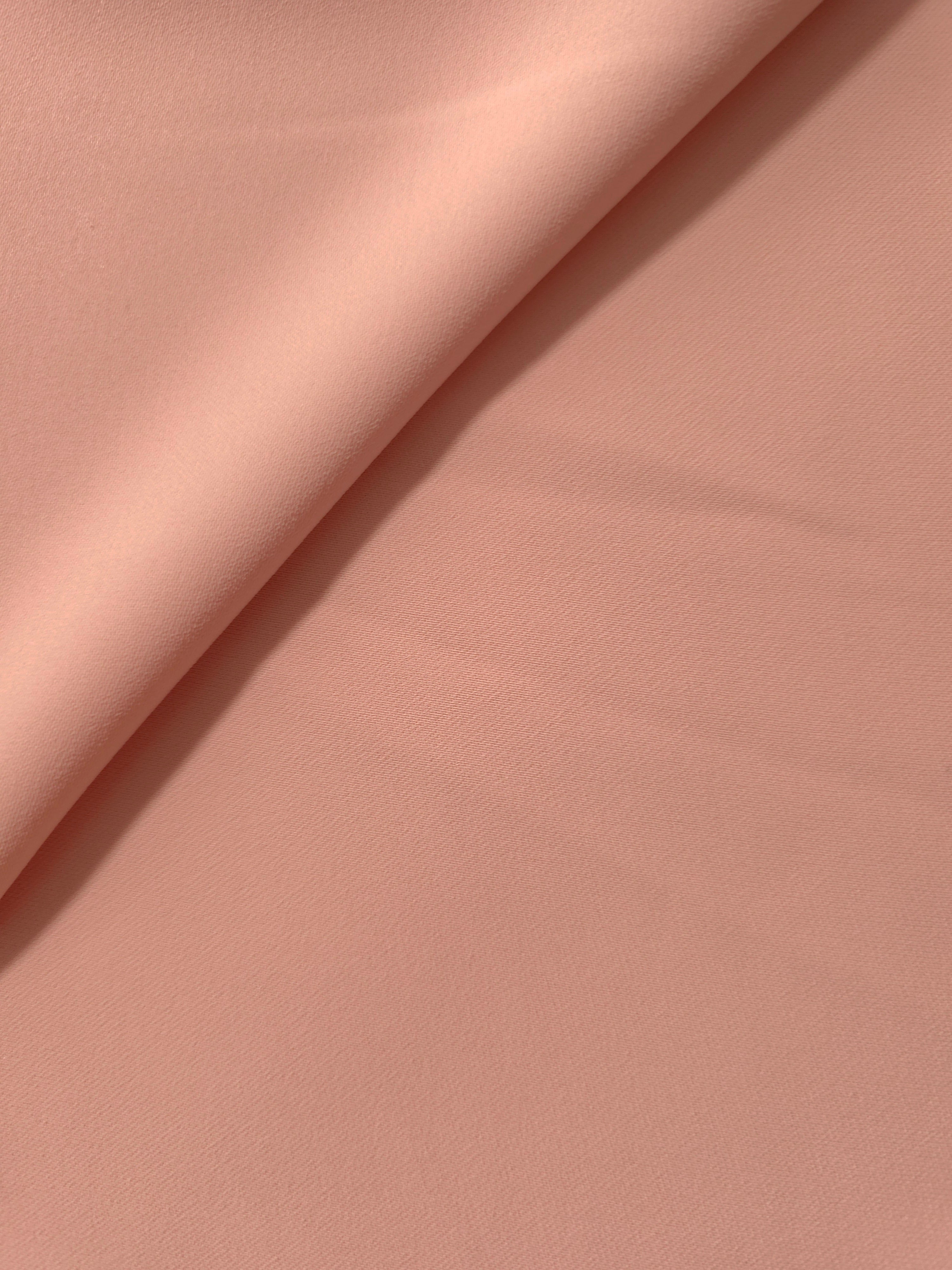 Rose Beige polyester crepe gathered into a soft fold, showing fluid drape for dresses and blouse making