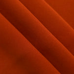Rust Orange mechanical polyester crepe layered to show soft structure for tailored garments and separates