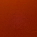 Close woven detail of Rust Orange 100% polyester Korean crepe showing its smooth texture and soft finish