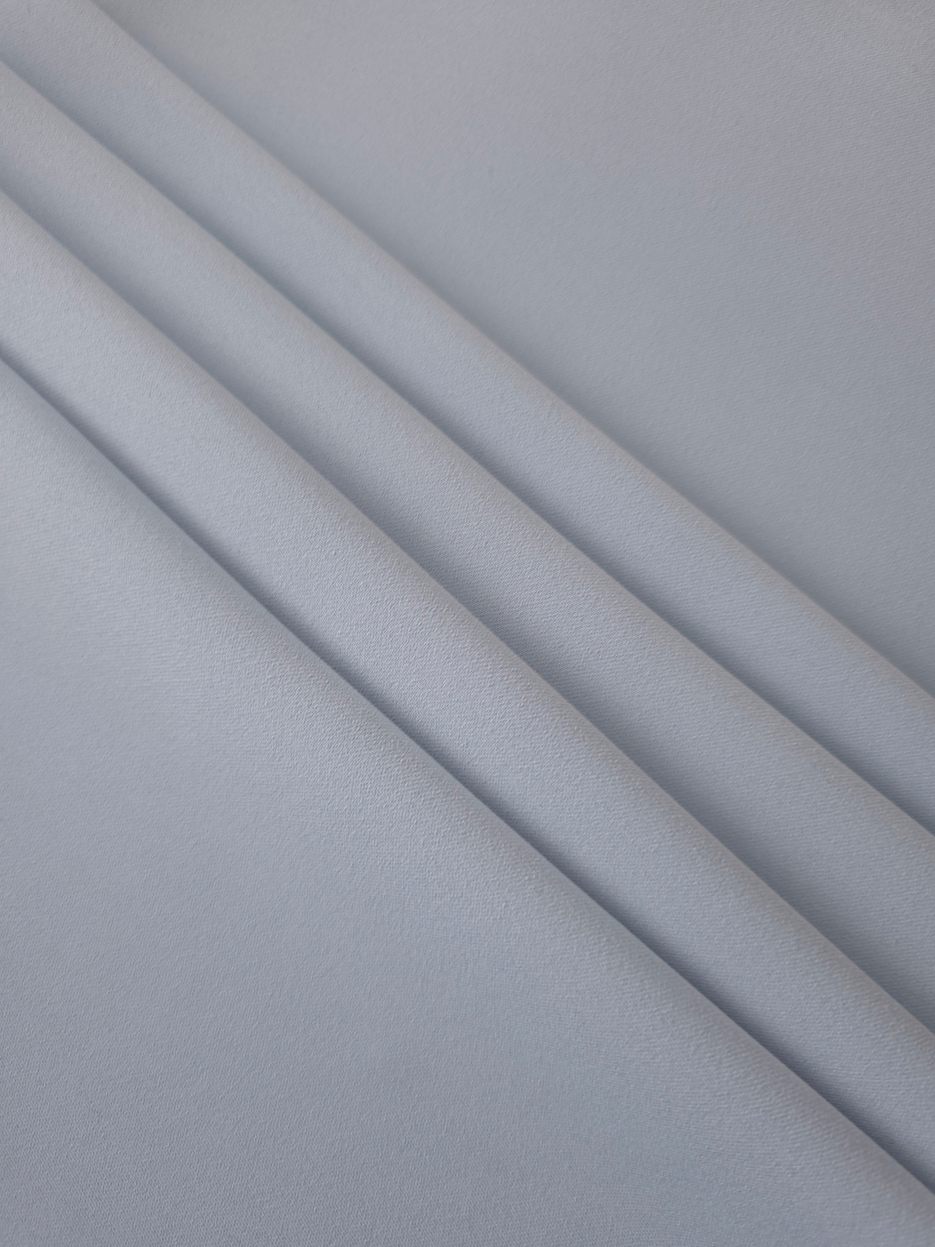 Silver Blue mechanical polyester crepe layered to show soft structure for tailored garments and separates