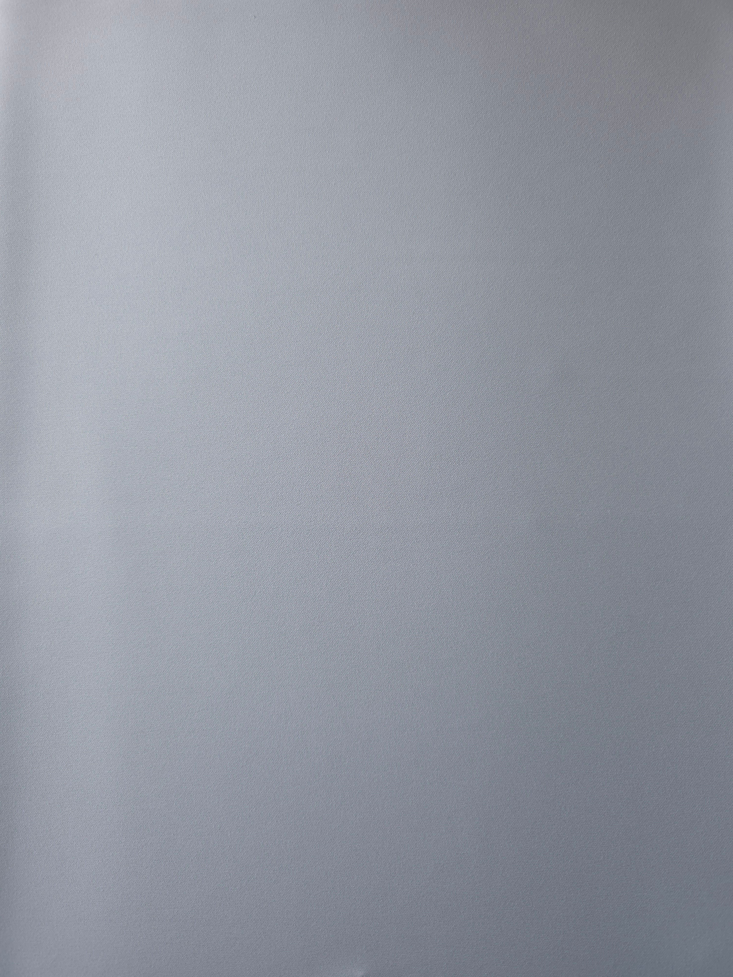 Surface view of Silver Blue 205 GSM polyester crepe, opaque Korean dress fabric with a smooth woven finish