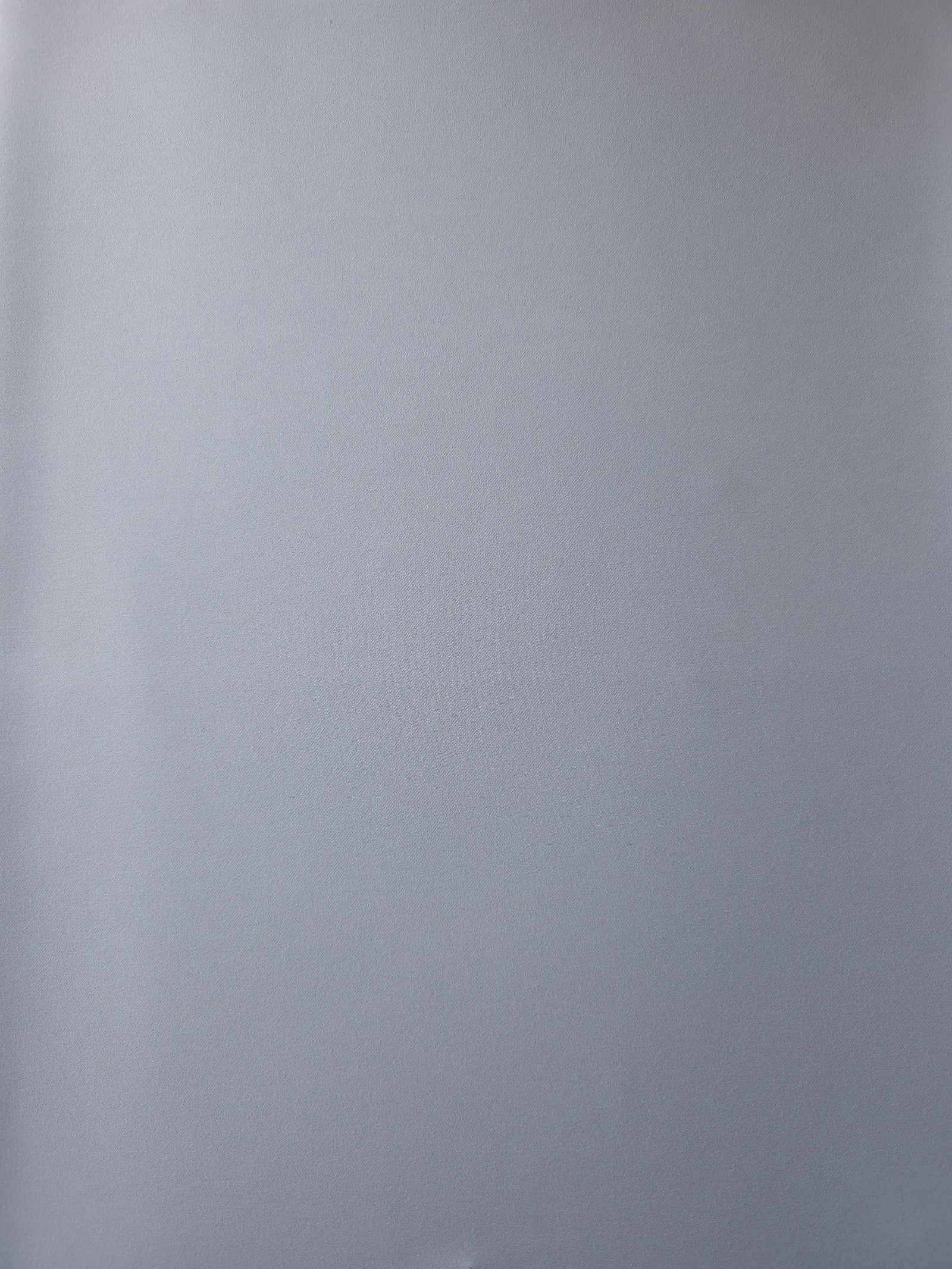 Surface view of Silver Blue 205 GSM polyester crepe, opaque Korean dress fabric with a smooth woven finish