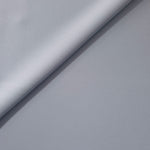 Loose fold of Silver Blue polyester crepe showing smooth fluid drape for dresses, skirts and soft tailoring