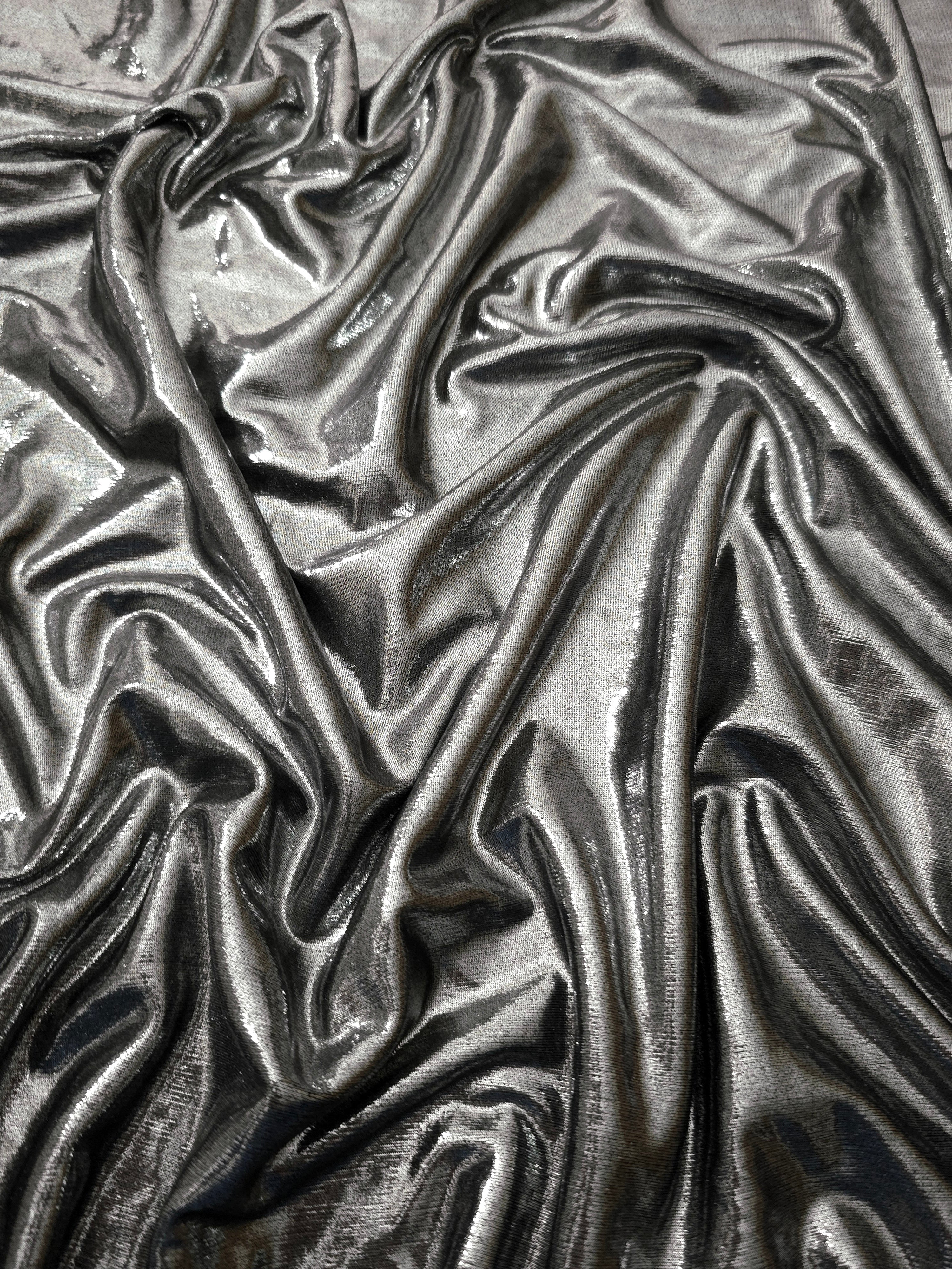 Softly draped Silver Gray foiled spandex fabric showing fluid shape and metallic shimmer for dresses, stage costumes and eventwear