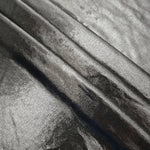 Silver Gray foiled spandex arranged in layered folds, displaying shimmer and soft structure for skirts, tops and performancewear