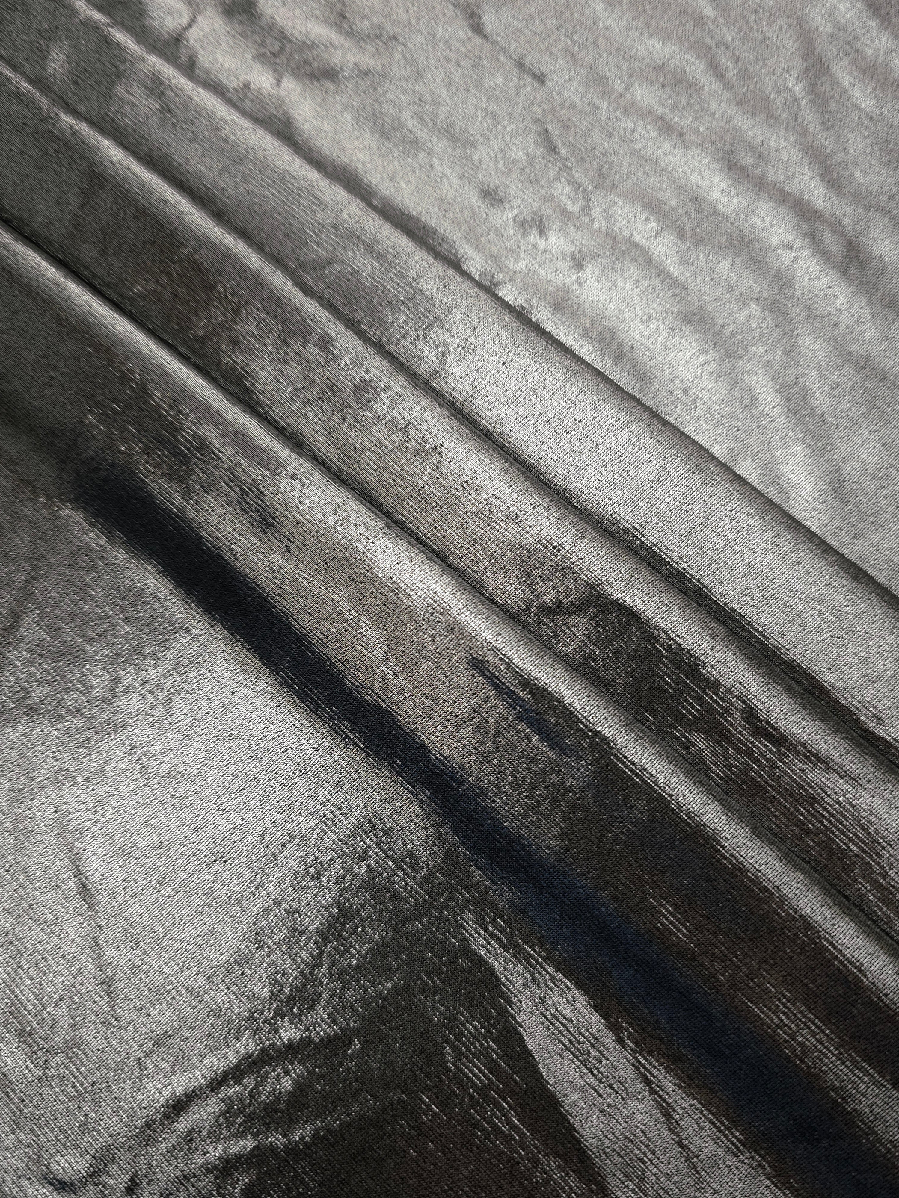 Silver Gray foiled spandex arranged in layered folds, displaying shimmer and soft structure for skirts, tops and performancewear