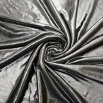 Flowing swirl of Silver Gray metallic stretch fabric, showing dynamic foil reflection for stagewear, skirts and creative fashion