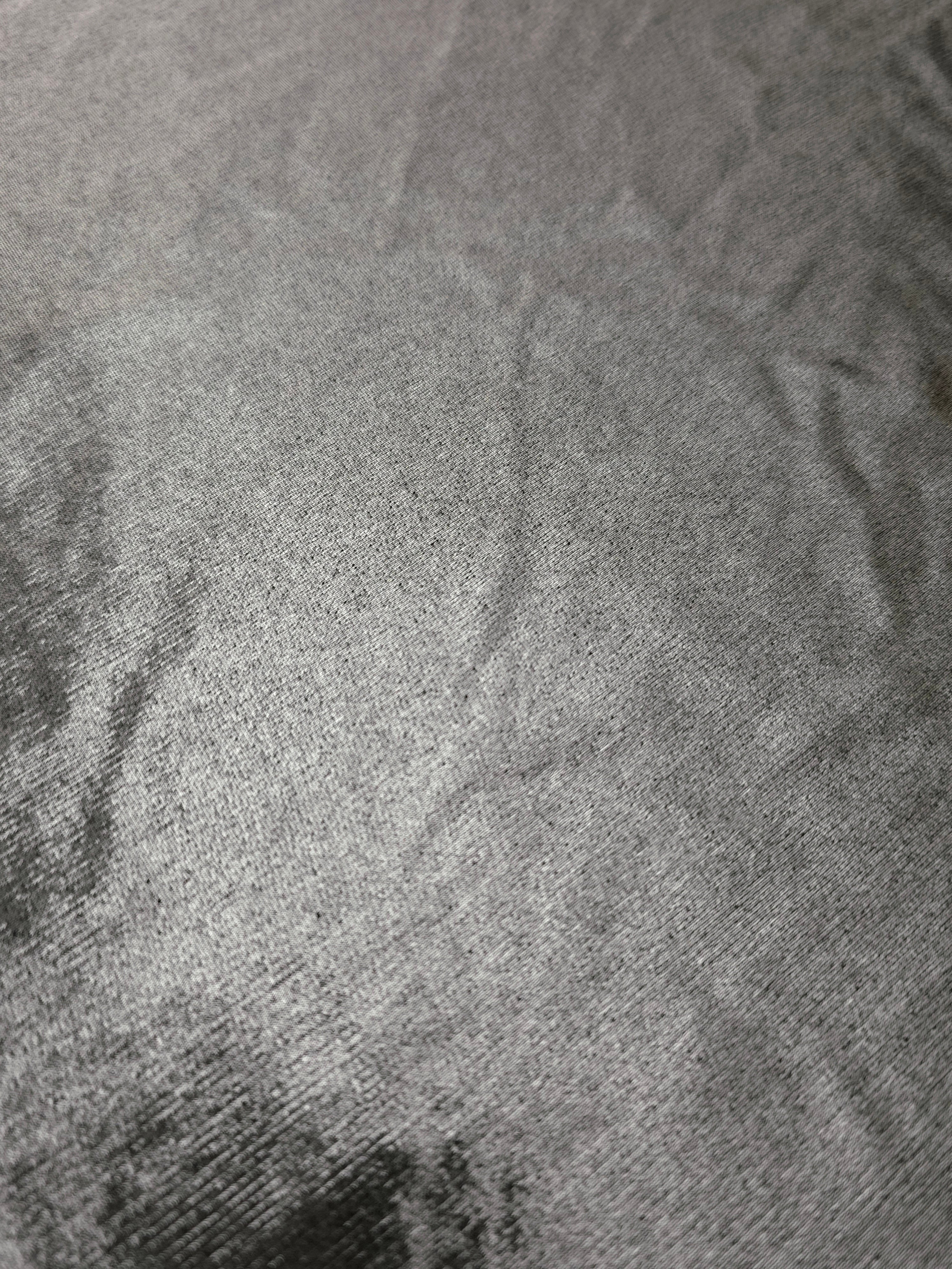 Silver Gray foiled stretch fabric texture close-up, displaying metallic reflection and fine surface character for apparel design