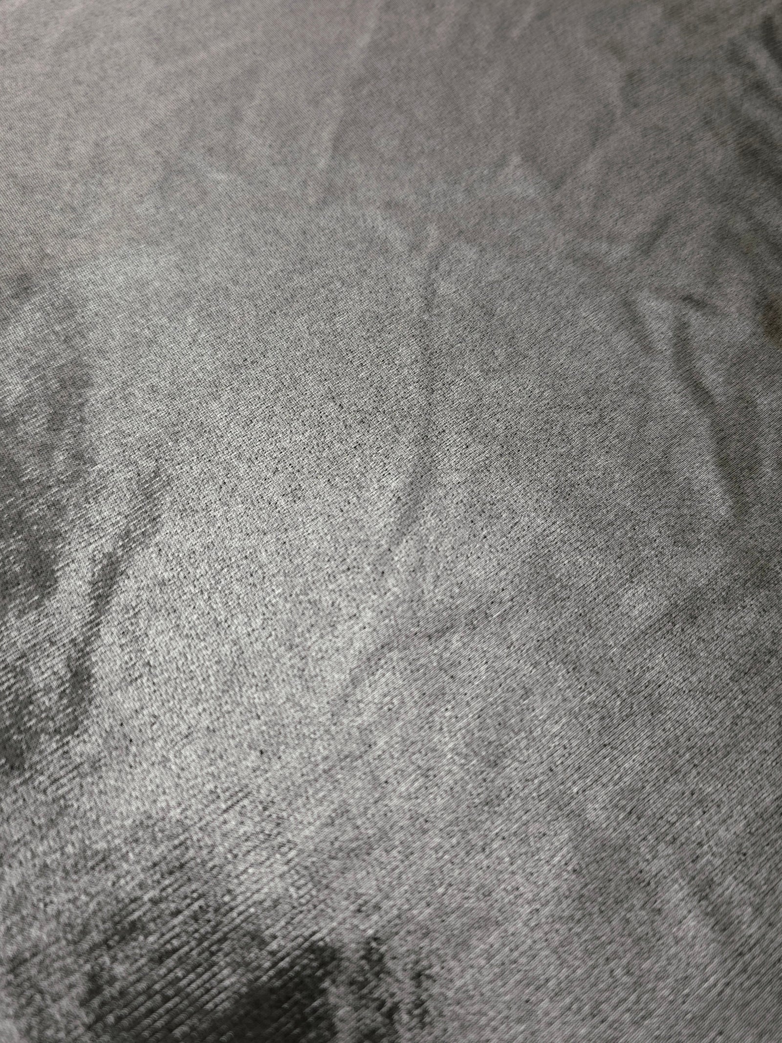 Silver Gray foiled stretch fabric texture close-up, displaying metallic reflection and fine surface character for apparel design