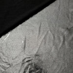 Softly folded Silver Gray foiled spandex showing metallic shine and flexible hand for costumes, eveningwear and creative sewing